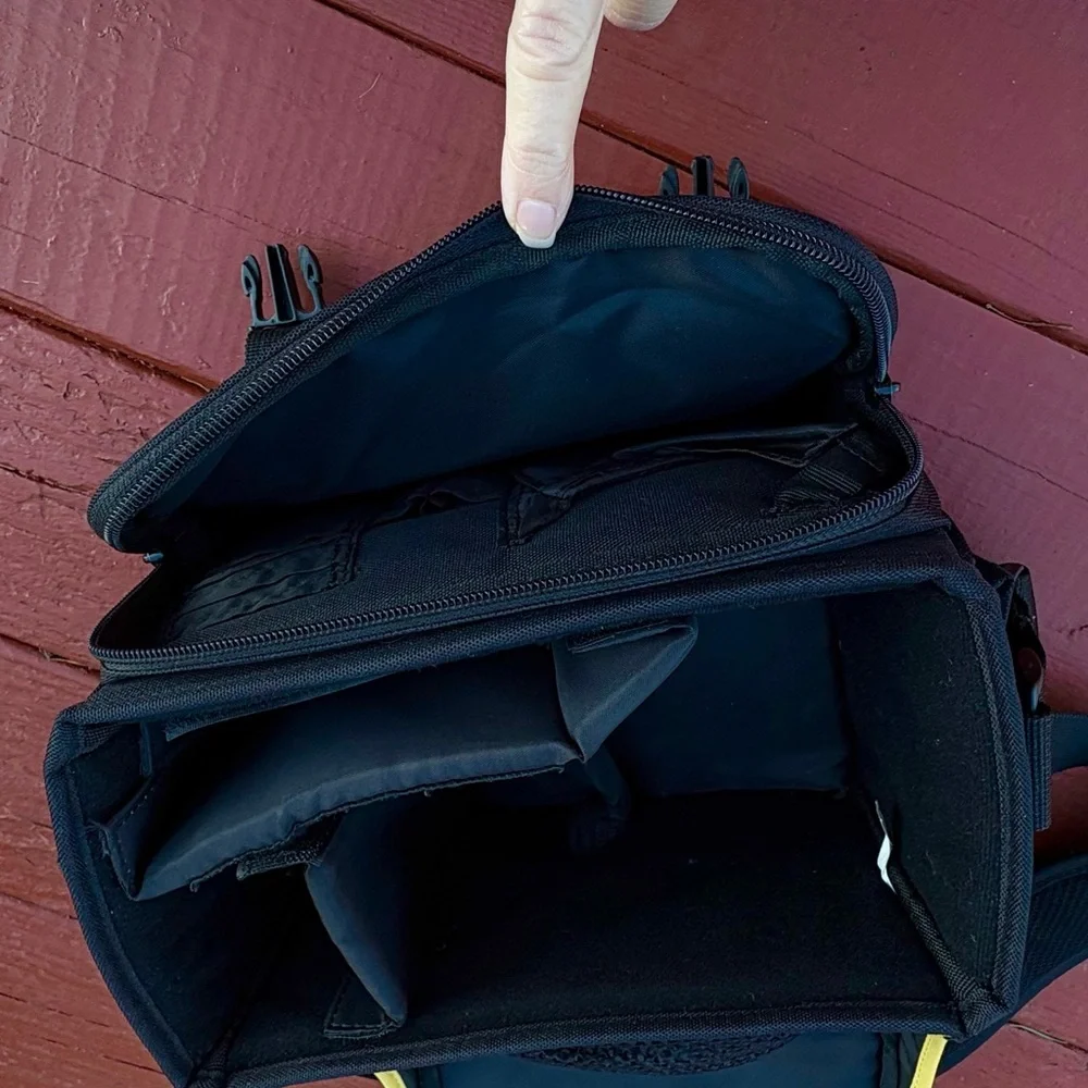 Nikon black camera and accessory shoulder carrying bag